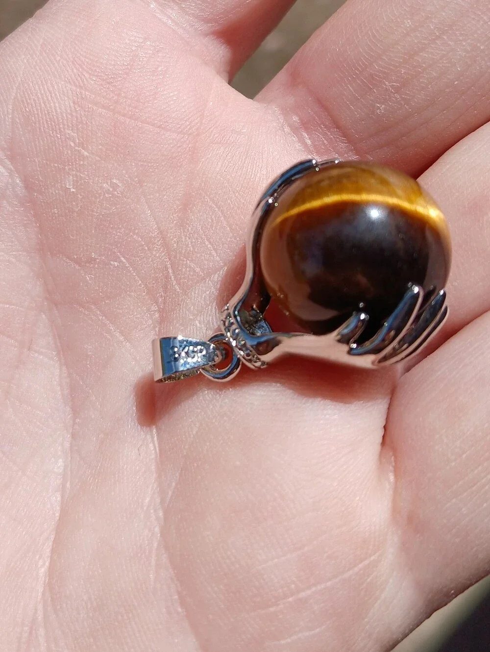 New 18K Hands Holding Tiger Eye Sphere Pendant.